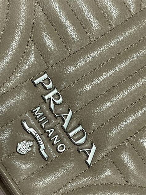 prada nappa impunture diagramme sling bag|PRADA Nappa Impunture Small Diagramme Crossbody Bag.